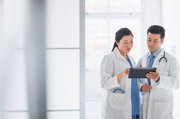 doctors reviewing information on tablet