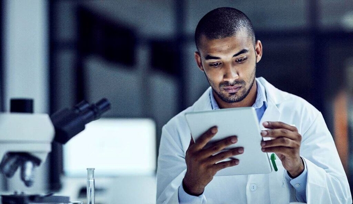 scientist using tablet in lab